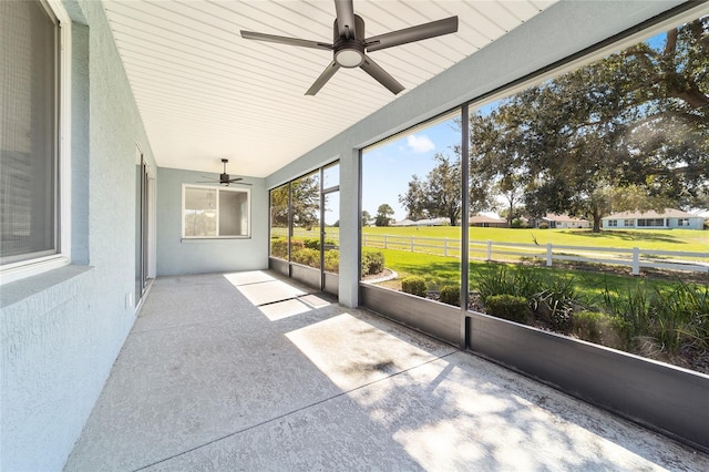 unfurnished sunroom featuring lofted ceiling