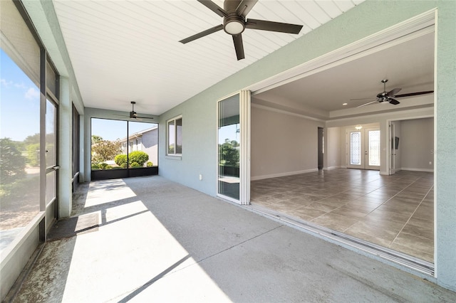 unfurnished sunroom featuring french doors