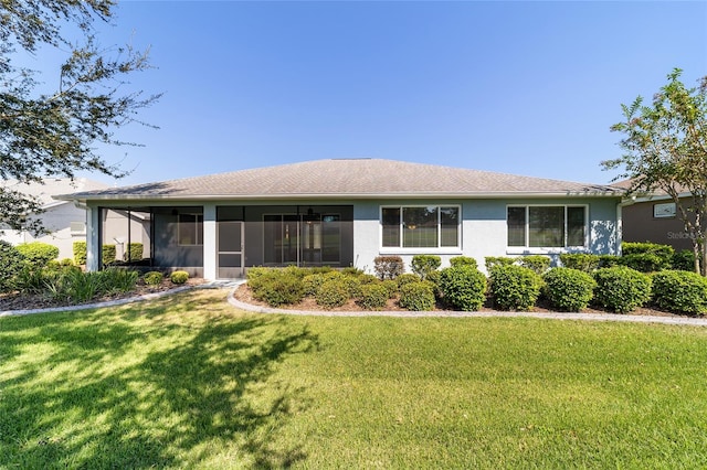 ranch-style home with a front yard and a sunroom