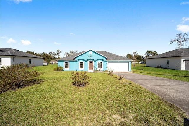 ranch-style house with a garage and a front lawn