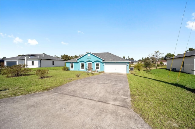 ranch-style home featuring a garage and a front yard