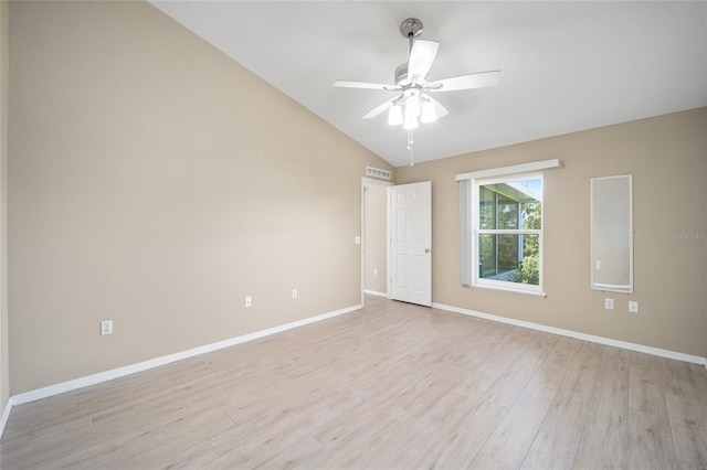 empty room with lofted ceiling, ceiling fan, and light hardwood / wood-style flooring