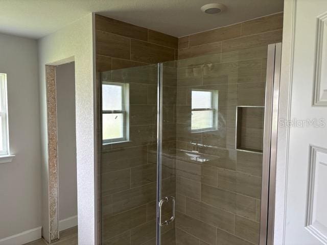 bathroom with a shower stall