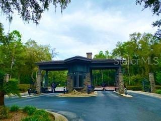 view of property's community with aphalt driveway