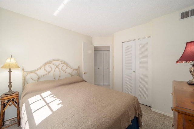 bedroom with a closet and carpet flooring