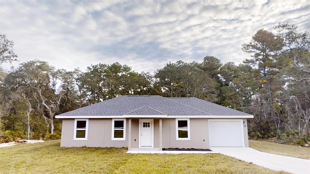 ranch-style home featuring a front yard and a garage