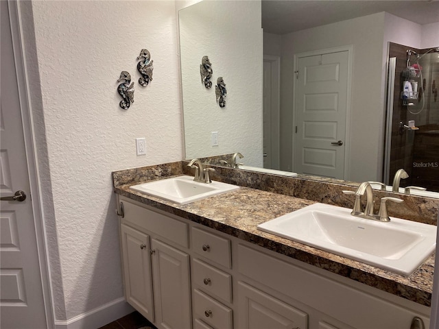 bathroom featuring vanity and an enclosed shower