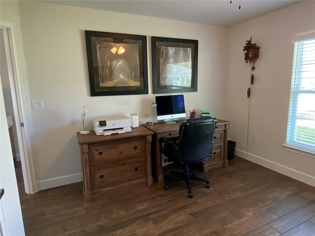 office space with dark hardwood / wood-style flooring and a wealth of natural light