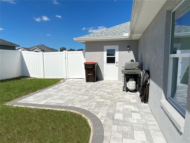 view of patio featuring a grill