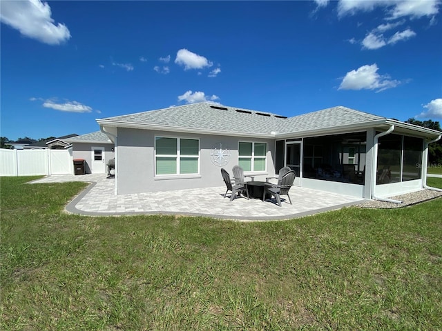 back of property featuring a yard and a patio area