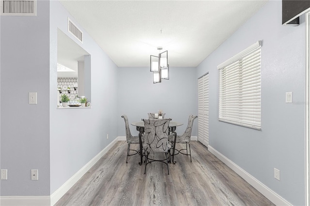 dining area featuring light wood-type flooring