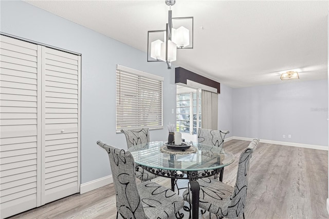 551 Fairways Dr Unit A, Ocala, FL 34472 - dining area with baseboards and light wood finished floors