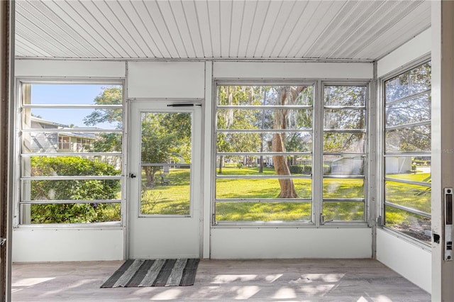 unfurnished sunroom with a healthy amount of sunlight