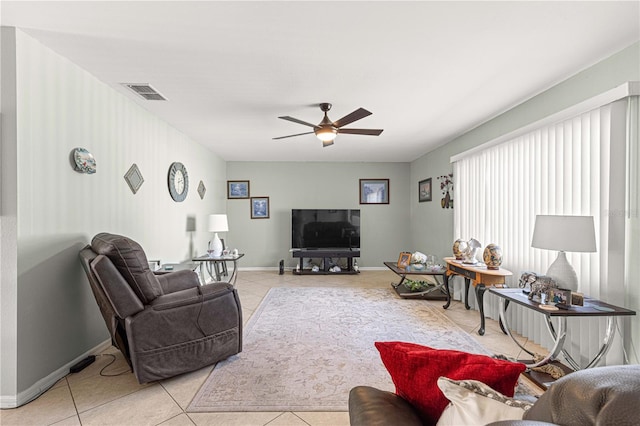 living room with ceiling fan and light tile patterned floors