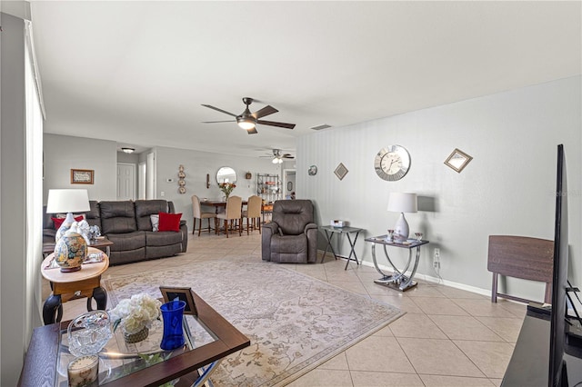 tiled living room with ceiling fan