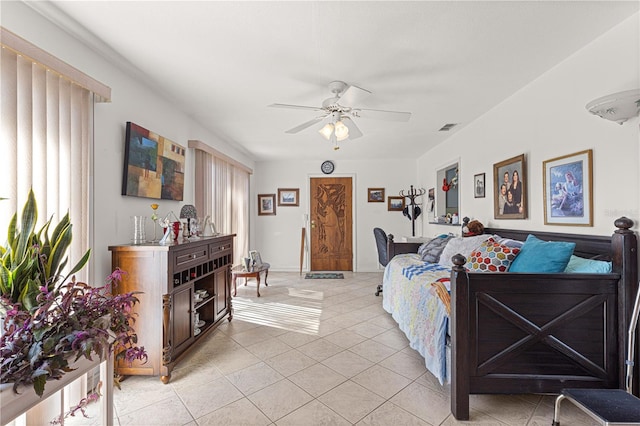 tiled living room featuring ceiling fan