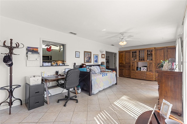 bedroom with light tile patterned flooring and ceiling fan