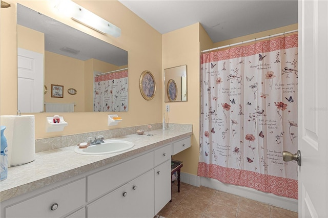 bathroom featuring vanity, a shower with curtain, and tile patterned flooring