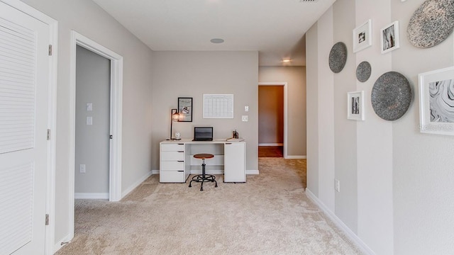 office space with light colored carpet