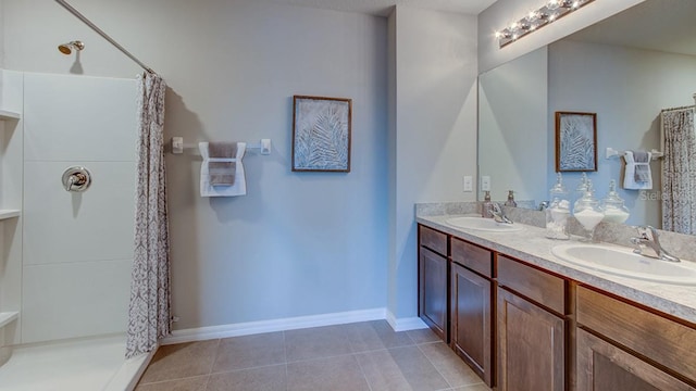 bathroom with a shower with curtain, vanity, and tile patterned flooring