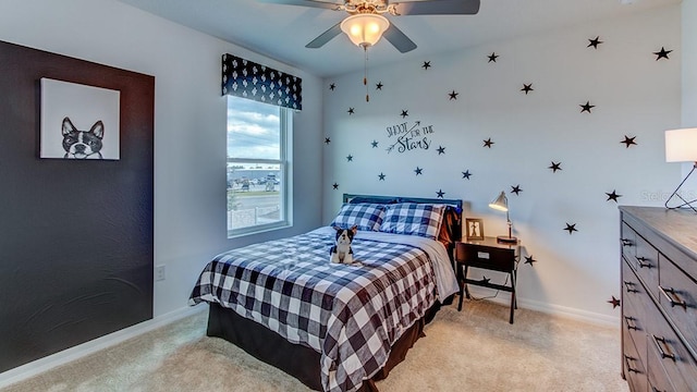 bedroom featuring ceiling fan and light carpet