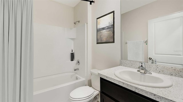 full bathroom with bathtub / shower combination, vanity, and toilet