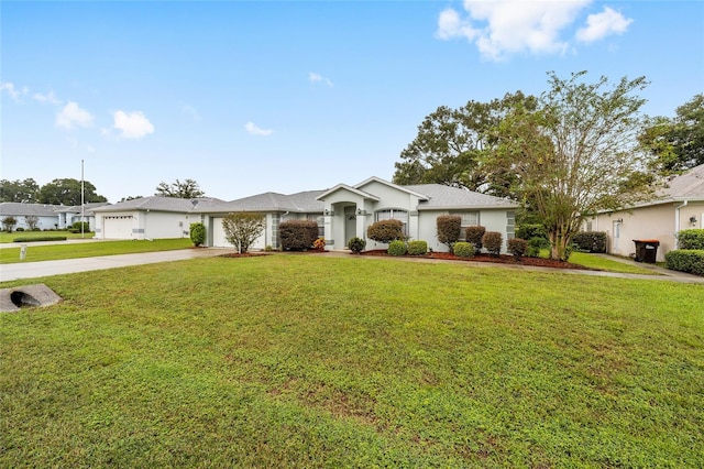 ranch-style house with a front yard and a garage