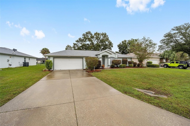 ranch-style home with a garage, a front lawn, and central air condition unit