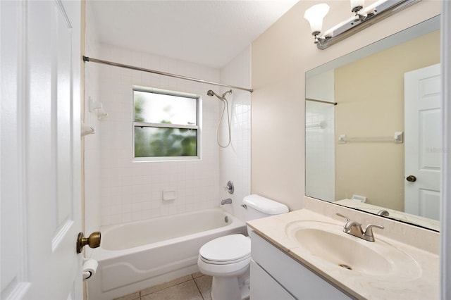 full bathroom featuring vanity, tiled shower / bath combo, toilet, and tile patterned flooring