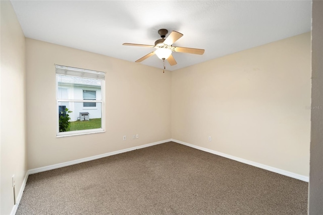 unfurnished room with ceiling fan and carpet floors