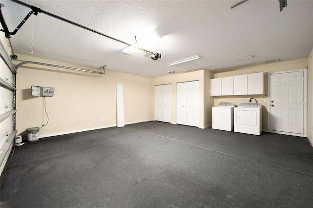 garage featuring a garage door opener and washing machine and dryer