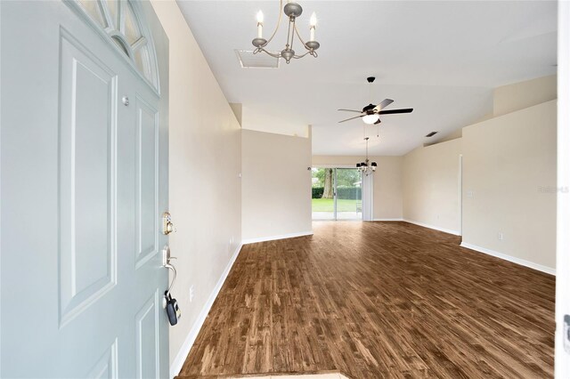 foyer featuring baseboards, ceiling fan with notable chandelier, and dark wood-type flooring