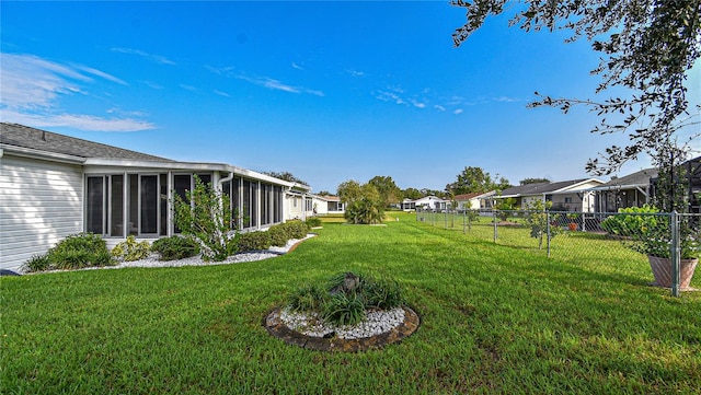 view of yard with a sunroom