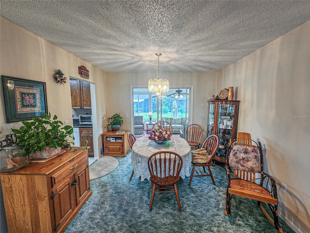 carpeted dining space featuring a textured ceiling and a notable chandelier