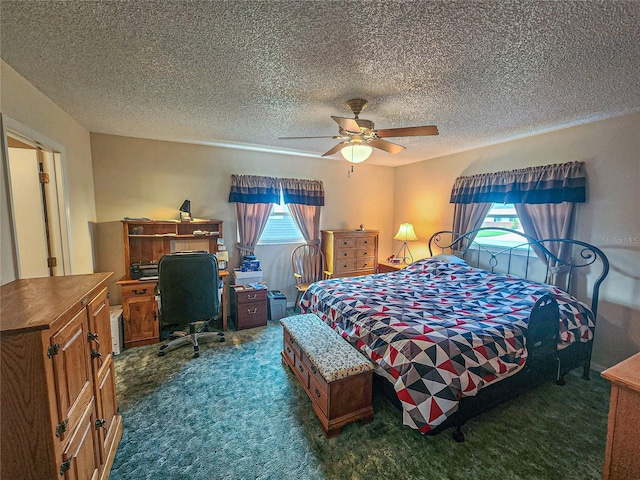 bedroom with dark carpet, a textured ceiling, and ceiling fan