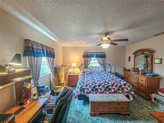 bedroom with ceiling fan, a textured ceiling, and carpet