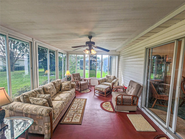 sunroom featuring ceiling fan