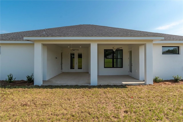 rear view of house featuring a patio, a lawn, and ceiling fan