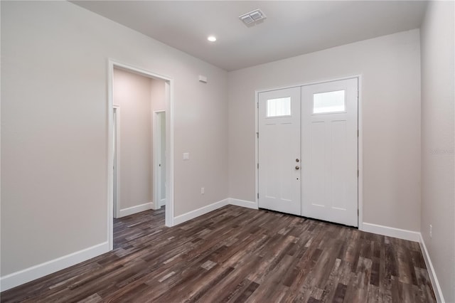 foyer with dark hardwood / wood-style flooring