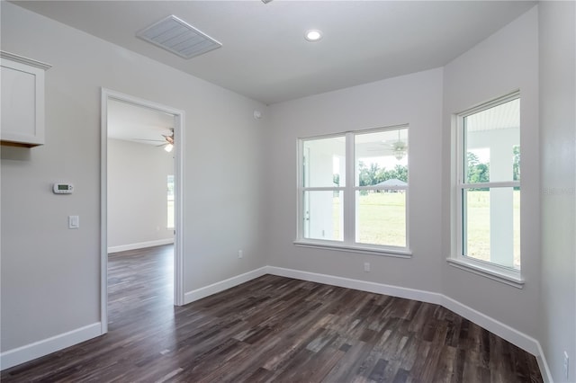 2073 NW 79th Loop, Ocala, FL 34475 - unfurnished room featuring healthy amount of natural light, dark wood-style flooring, a ceiling fan, baseboards, and recessed lighting
