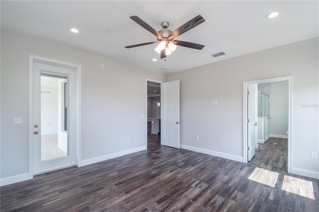 unfurnished bedroom with ceiling fan and dark hardwood / wood-style flooring