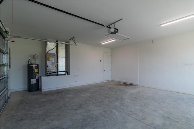 garage with a garage door opener and water heater