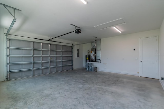 garage featuring a garage door opener and electric panel