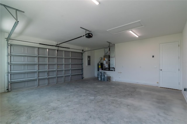 2073 NW 79th Loop, Ocala, FL 34475 - garage featuring electric panel, heating unit, a garage door opener, and electric water heater