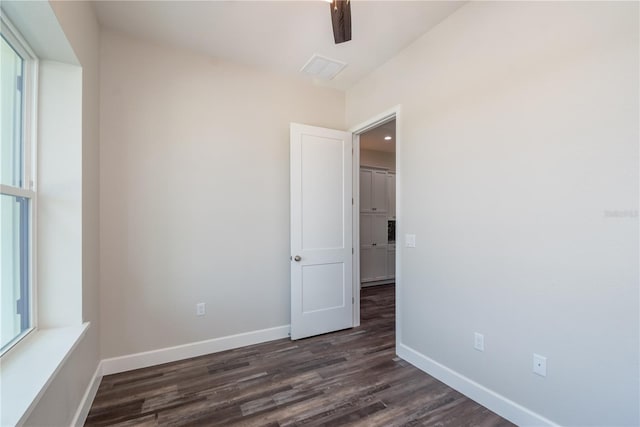 2073 NW 79th Loop, Ocala, FL 34475 - unfurnished room featuring dark wood-style flooring and baseboards