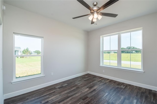 spare room featuring ceiling fan and dark hardwood / wood-style flooring