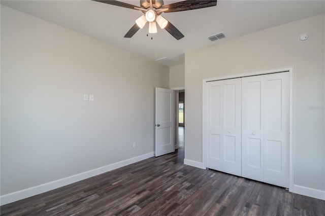 unfurnished bedroom featuring a closet, ceiling fan, and dark hardwood / wood-style floors