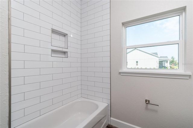 2073 NW 79th Loop, Ocala, FL 34475 - bathroom with baseboards and shower / bath combination
