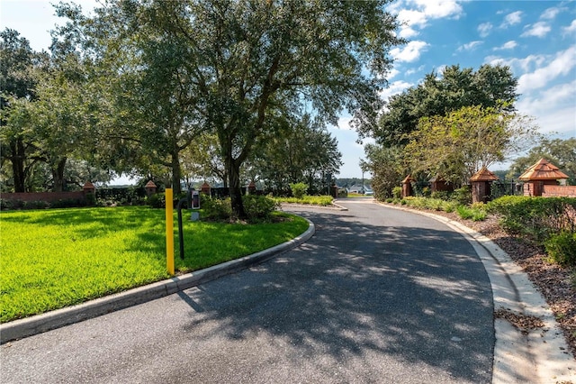 2073 NW 79th Loop, Ocala, FL 34475 - view of asphalt road with curbs