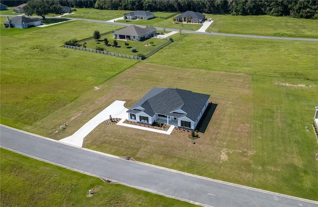 birds eye view of property with a rural view